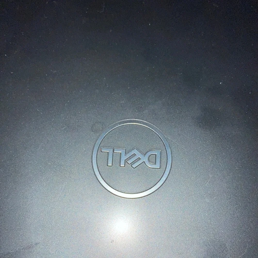 Dell laptop with mouse included.